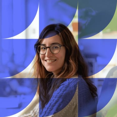 Smiling woman with glasses and long hair against a purple background with geometric overlay.